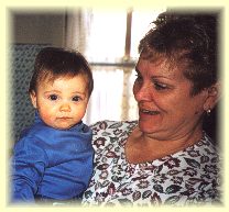 Grandma Sharon holding newest grandpup Stephen Grant Shanoltz.